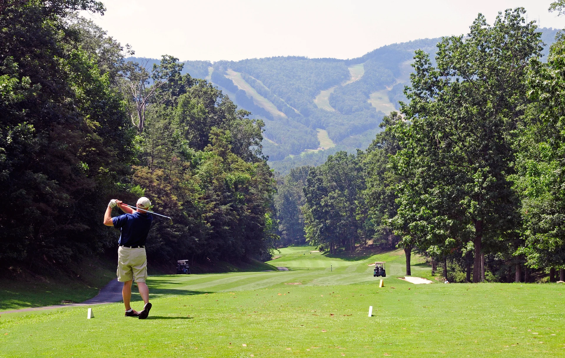 Massanutten mountain greens golfer teeing off mountain view